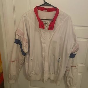 White jacket with red and blue detailing.
